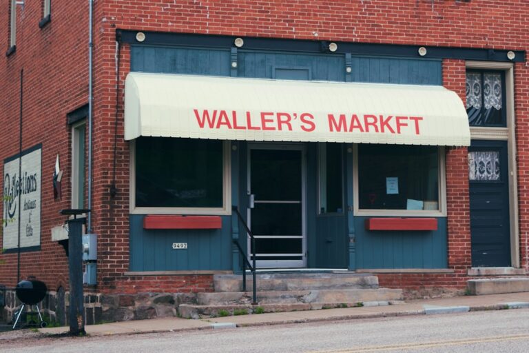 Waller's market storefront with red brick building.