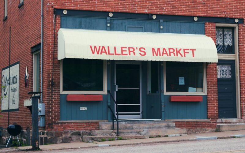 Waller's market storefront with red brick building.