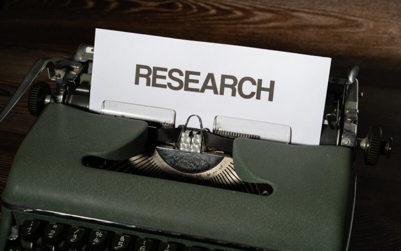 a close up of a typewriter with a paper on it