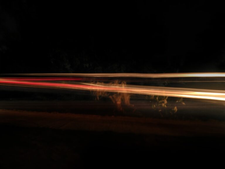 time lapse photography of cars on road during night time