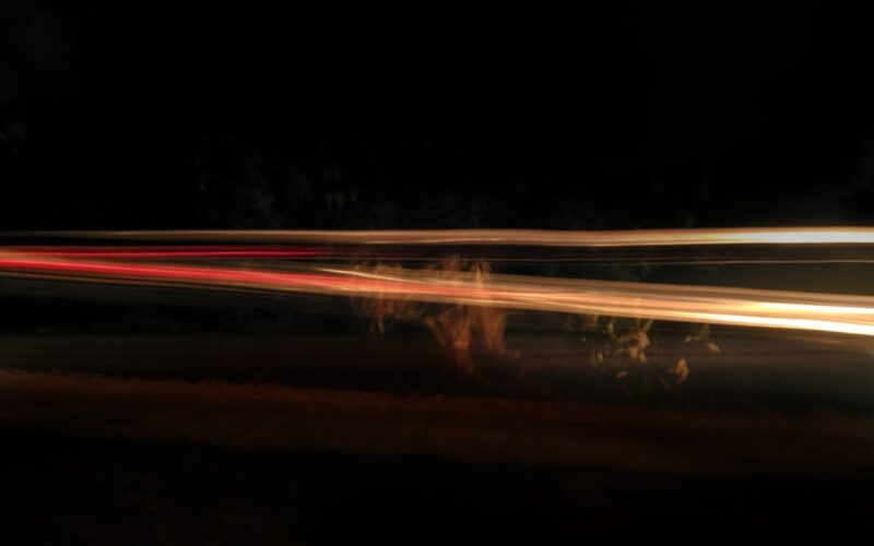 time lapse photography of cars on road during night time