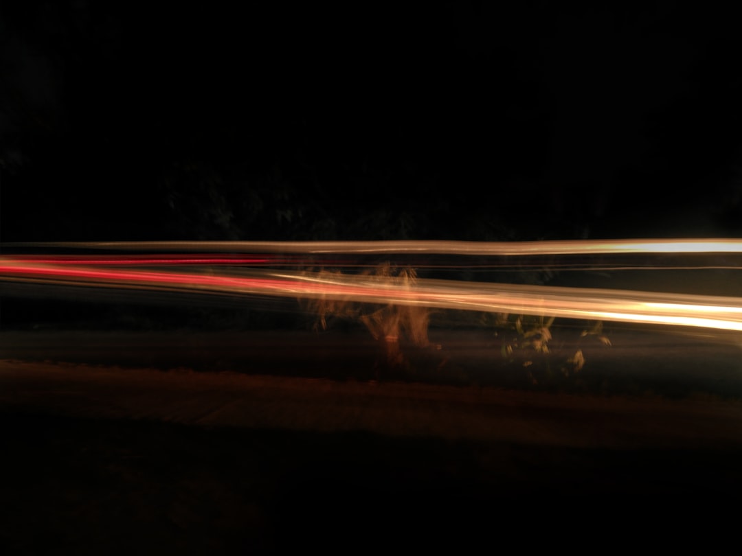 time lapse photography of cars on road during night time