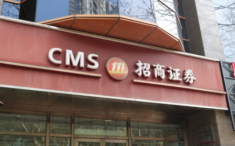 a red building with a sign that says cms 11